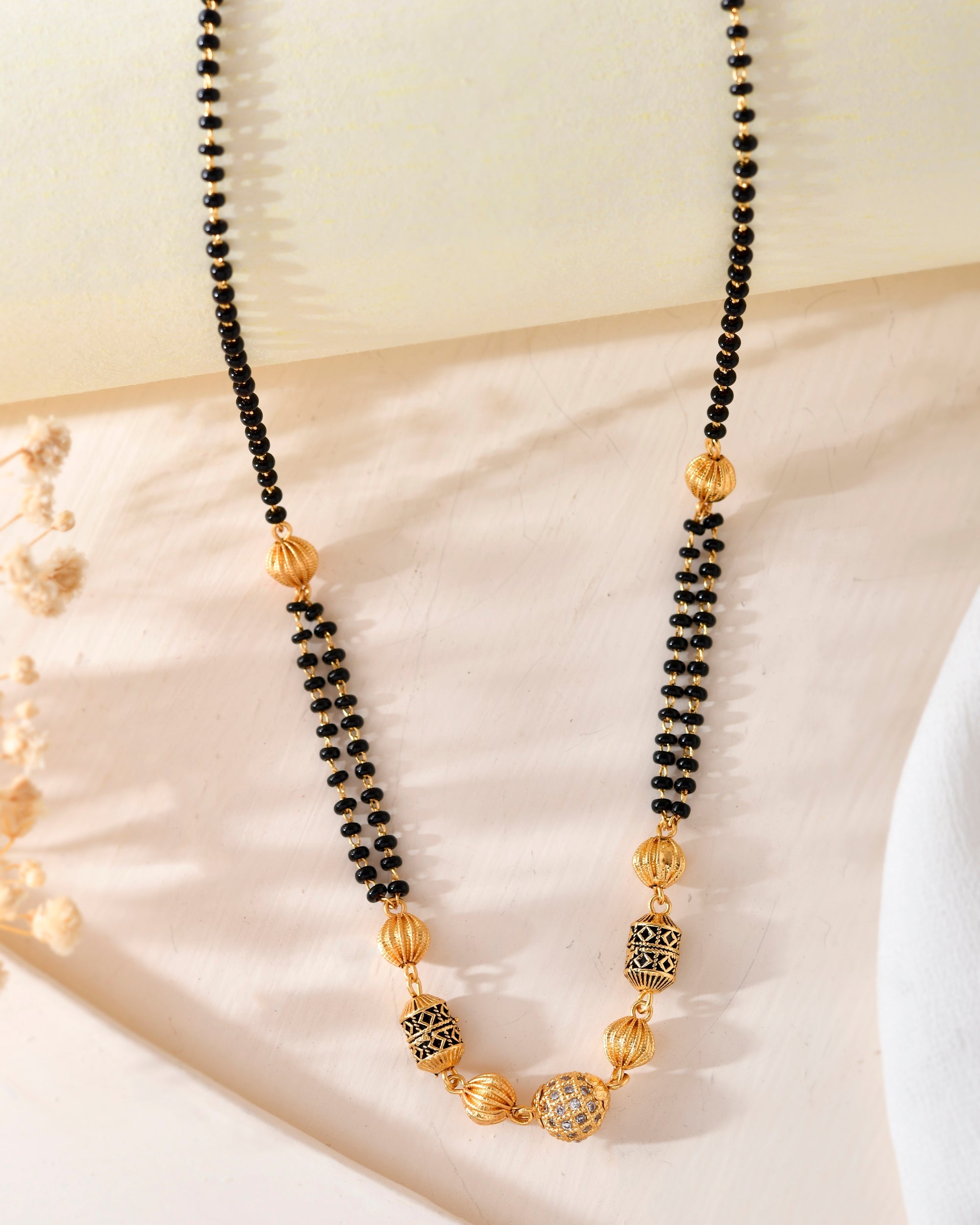 VOJ Gold-Polished Stone Studded Cricular shaped Mangalsutra | Grocsy