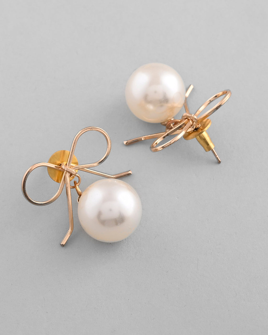 VOJ Gold-Polished Pearl & Bow Shaped Classic Drop Earrings | Grocsy