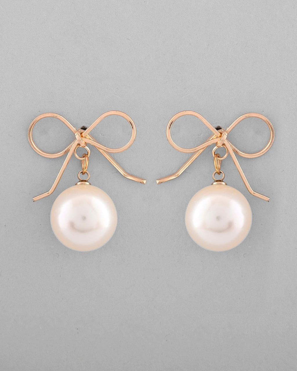 VOJ Gold-Polished Pearl & Bow Shaped Classic Drop Earrings | Grocsy
