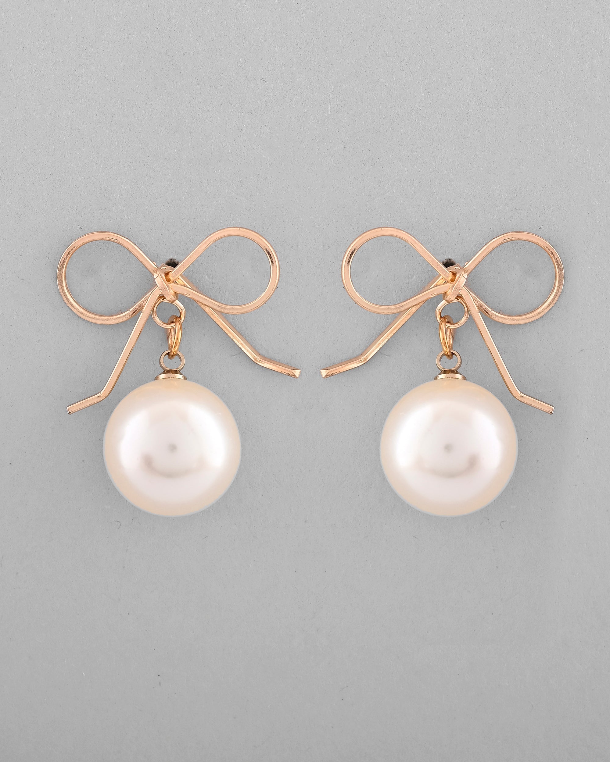 VOJ Gold-Polished Pearl & Bow Shaped Classic Drop Earrings | Grocsy