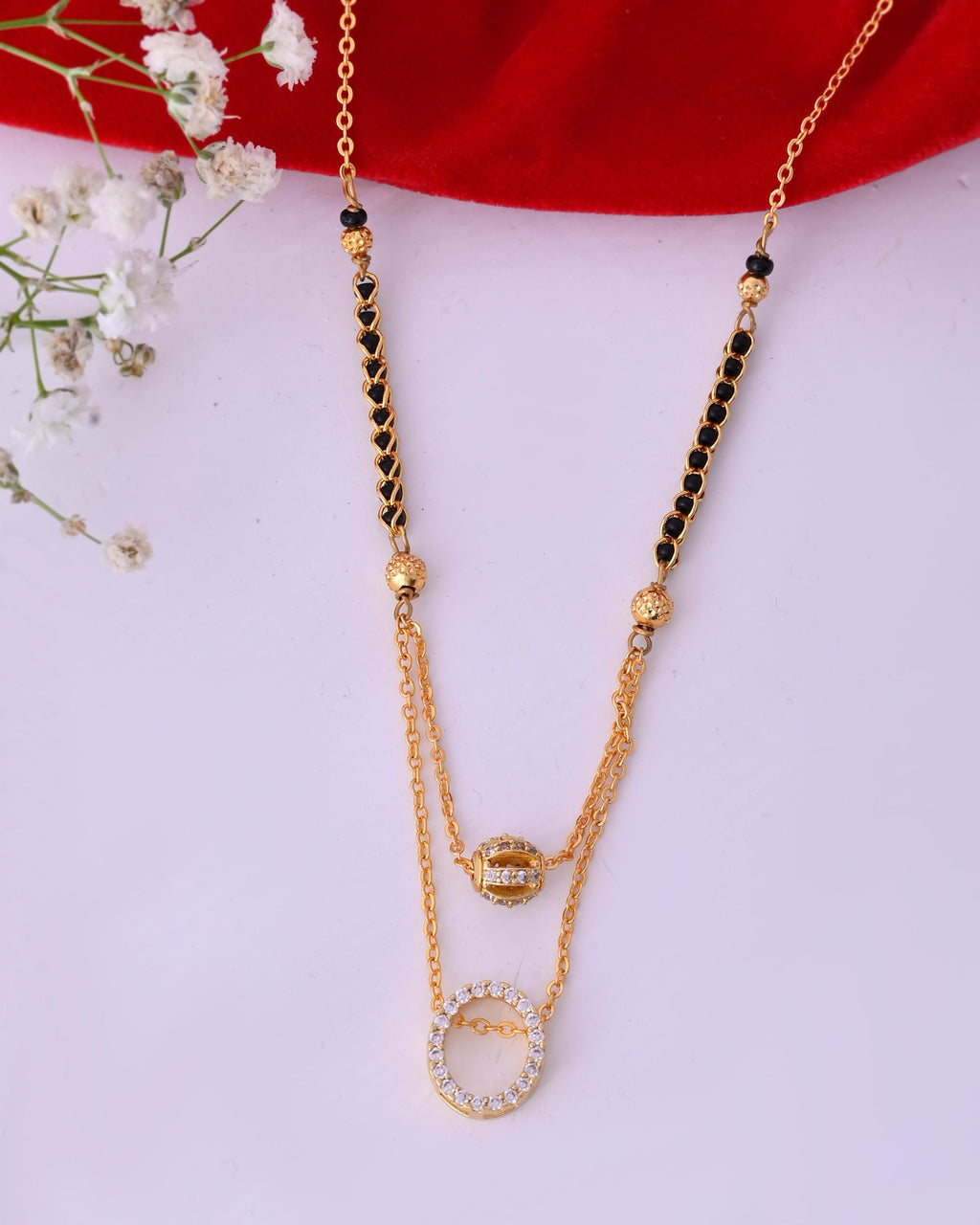 VOJ Gold-Polished Ad Studded Oval Shaped Mangalsutra | Grocsy