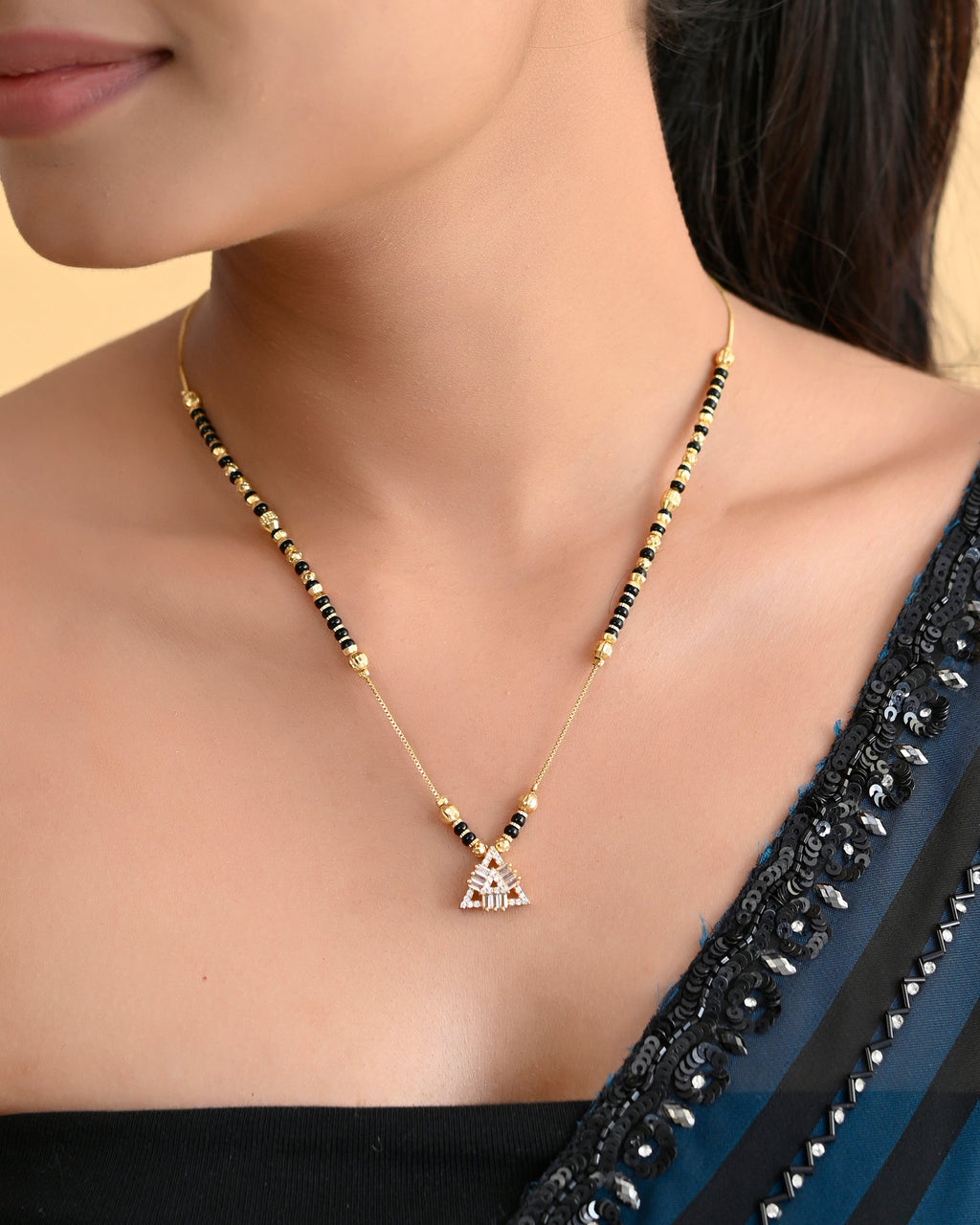 VOJ Gold-Polished Stone Studded Triangular Shaped Mangalsutra | Grocsy