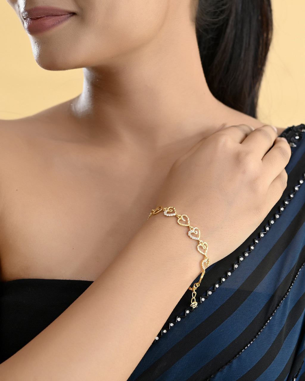 VOJ Gold-Polished Heart Shapped AD Stone Studded Women's Bracelet | Grocsy
