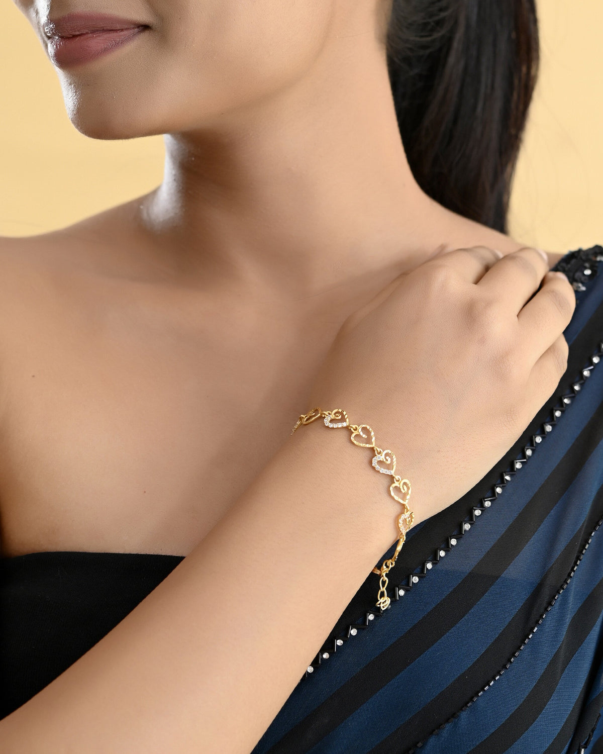 VOJ Gold-Polished Heart Shapped AD Stone Studded Women's Bracelet | Grocsy