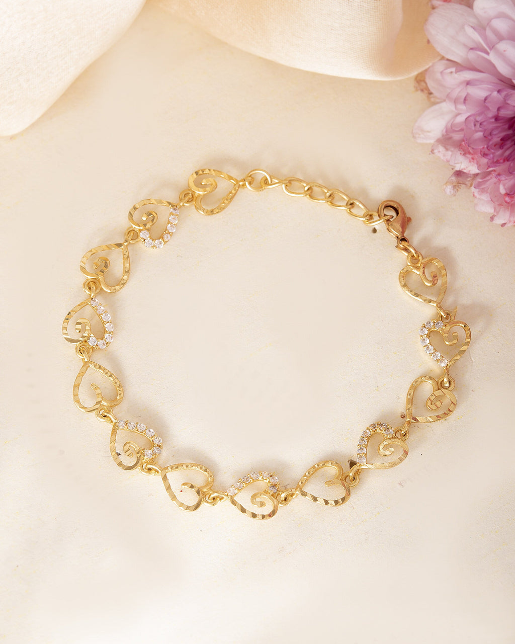 VOJ Gold-Polished Heart Shapped AD Stone Studded Women's Bracelet | Grocsy