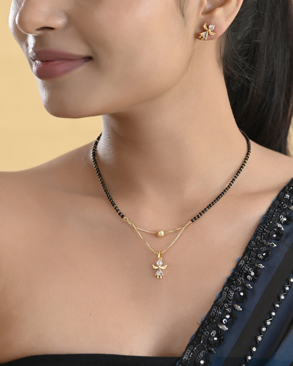 VOJ Gold-Polished Doll Shapped Stone Studded Mangalsutra With Earrings Set | Grocsy