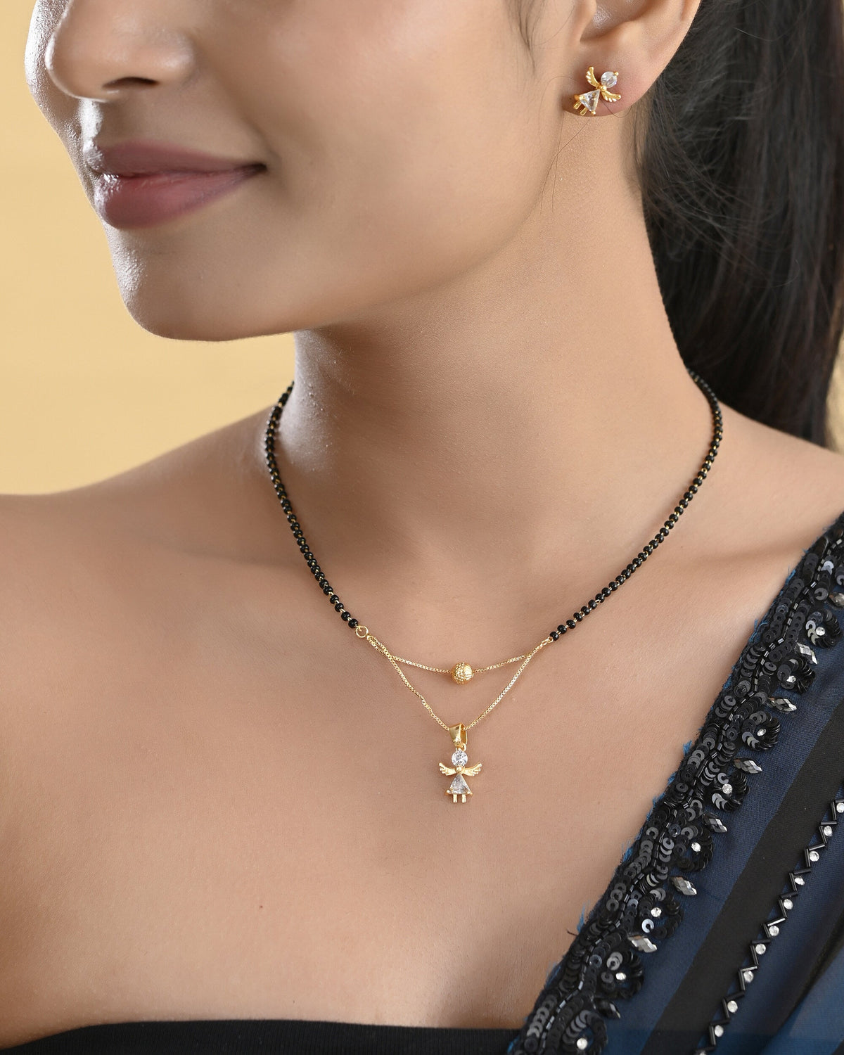 VOJ Gold-Polished Doll Shapped Stone Studded Mangalsutra With Earrings Set | Grocsy