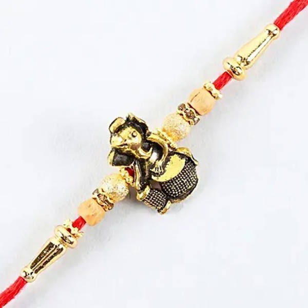 Devotional Lord Ganesha Rakhi & Kaju Roll Box | Grocsy