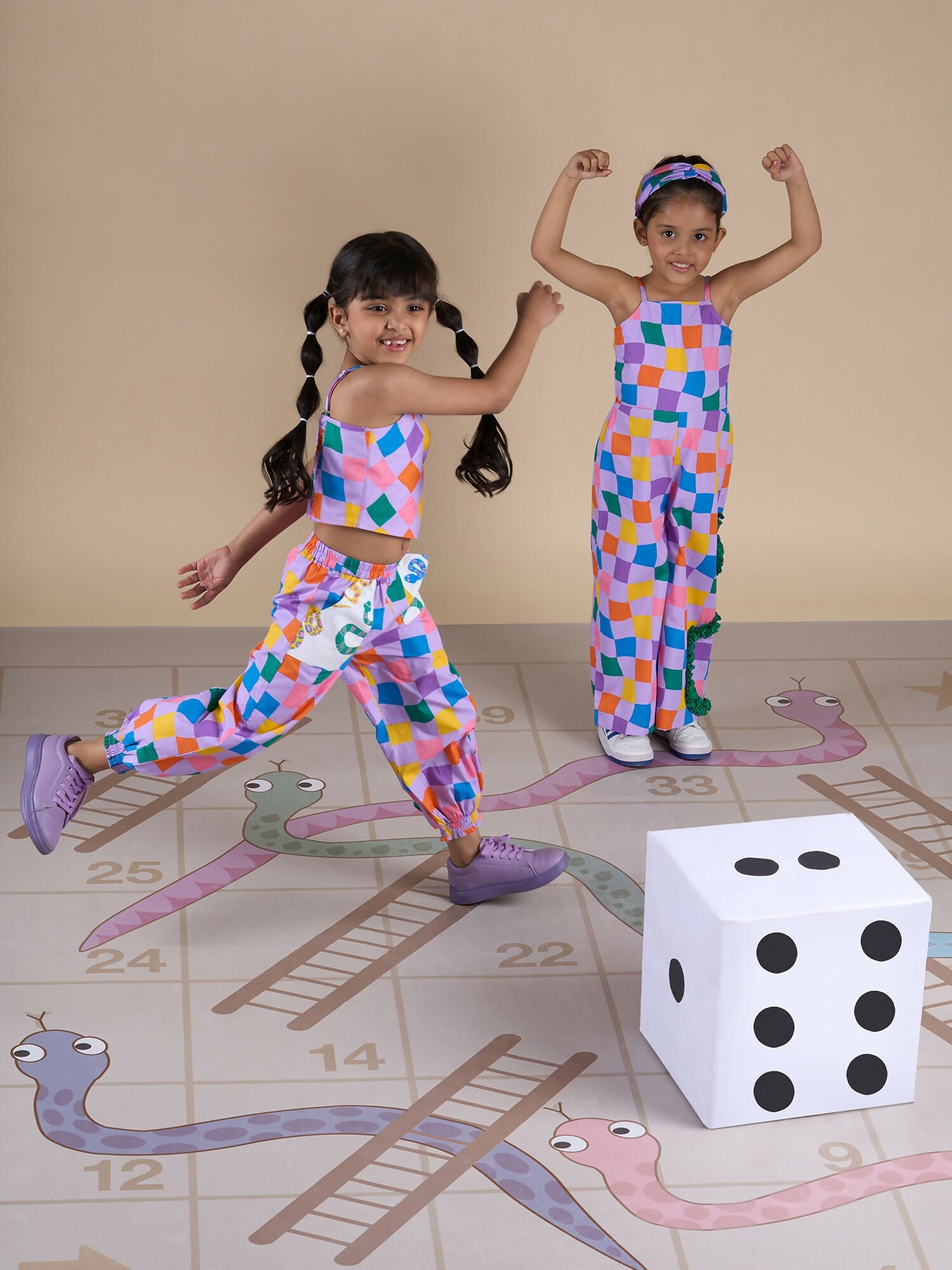 Snakes and Ladders Girls Multi Color Rotary Print Jumpsuit from Siblings Collection | Grocsy