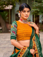 Vastranavya Patola Printed and Foil Work Tussar Silk Lehenga with Unstitched Blouse - Mustard | Grocsy