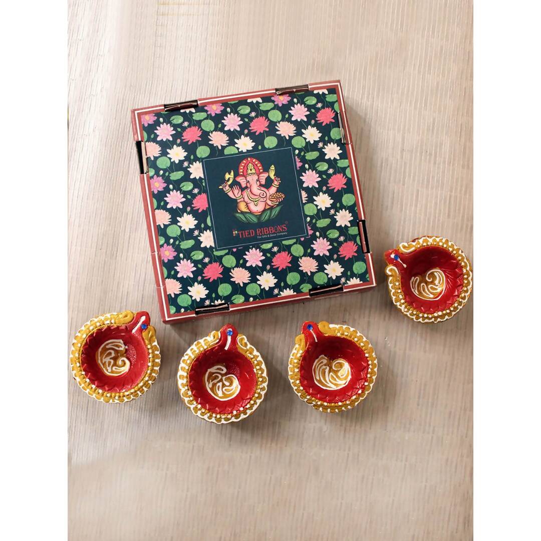 Tied Ribbons Set Of 4 Terracotta Diyas | Grocsy