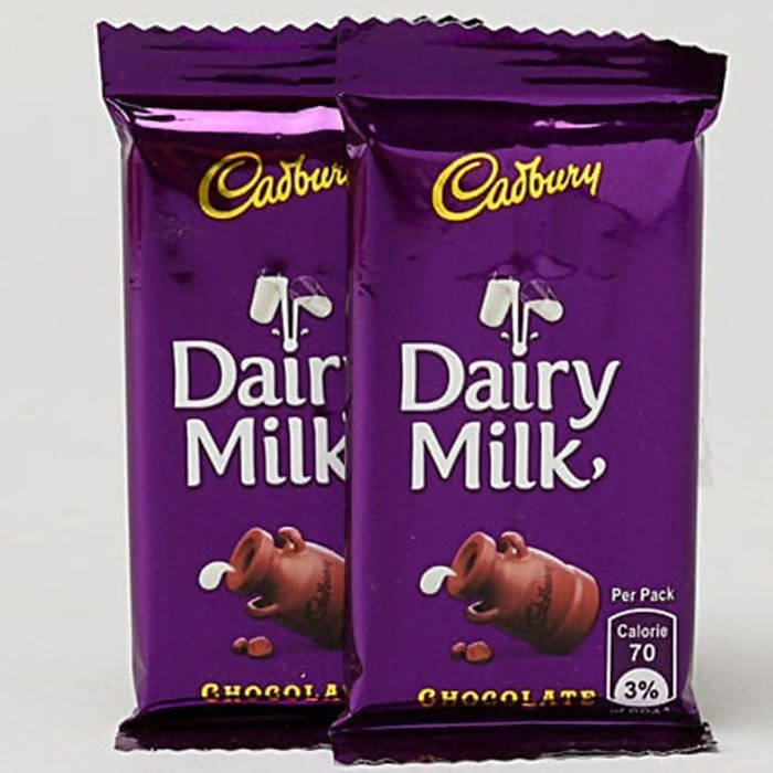 Ethnic Om Metal Rakhi & Dairy Milk Chocolates | Grocsy