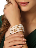 NVR Women Set of 2 Gold-Polished Traditional Pearls Beaded Bangles | Grocsy