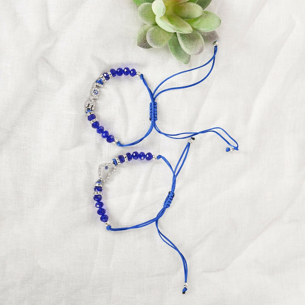 NVR Women & Men Set of 2 Blue Evil Eye Rakhi With Roli Chawal | Grocsy