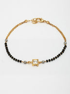 NVR Women Gold-Polished & Black Brass Stone-Studded Hand Mangalsutra Link Bracelet | Grocsy