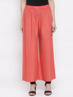 TAG 7 Women Peach-Coloured Solid Flared Palazzos | Grocsy