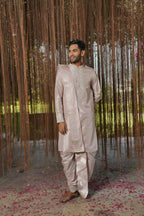 Sandstone Kanjivaram Machien Embroidered Pattu Set by Hilo Design | Grocsy