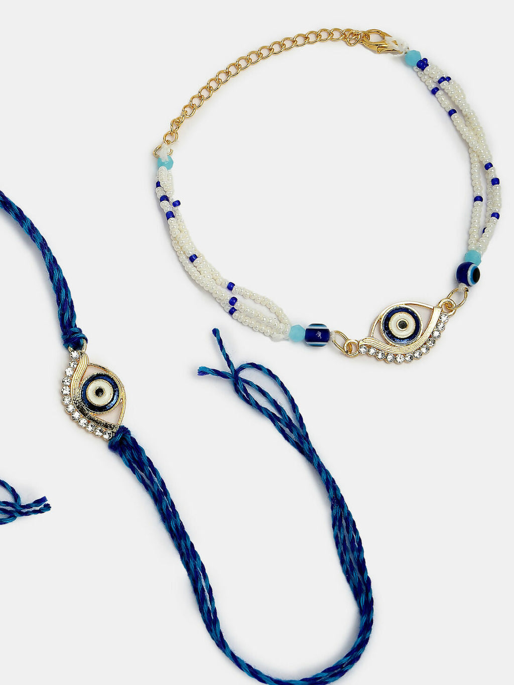 NVR Women & Men Set of 2 Blue Evil Eye Bhaiya Bhabhi Rakhi Set With Roli Chawal | Grocsy