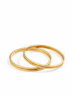 NVR Women Set of 4 Gold Plated Handcrafted CZ Studded Bangle | Grocsy