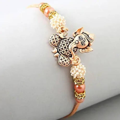 Holy Ganesha Rakhi & 24 Pcs Ferrero Rocher | Grocsy