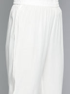 HERE&NOW Women Solid Panelled A-Line Kurta with Trousers | Grocsy