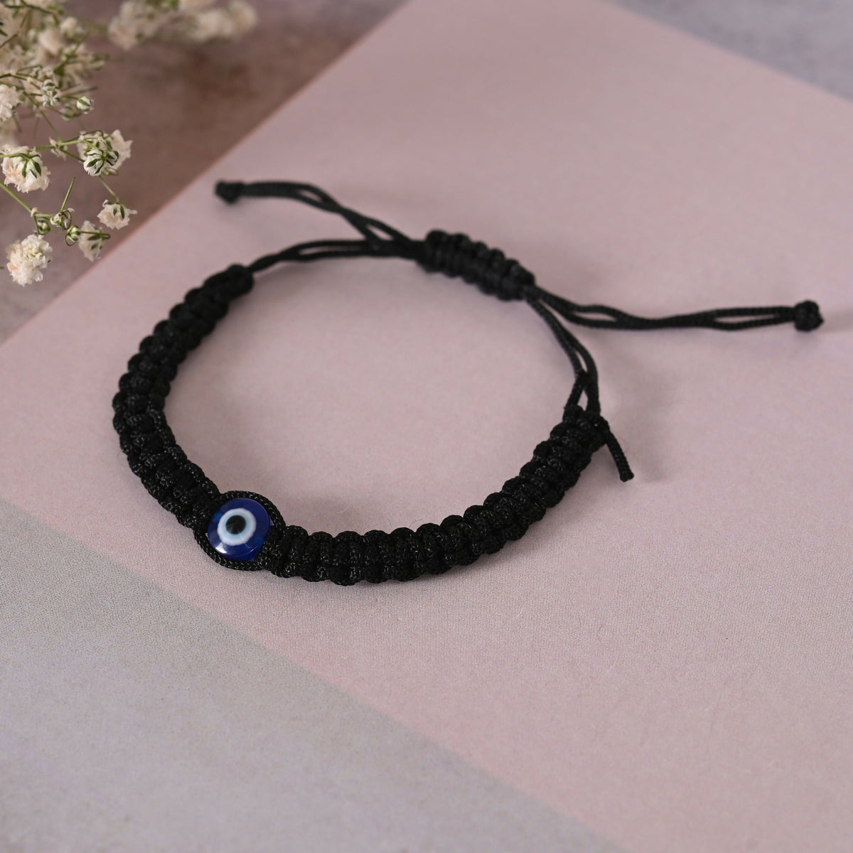 NVR Men & Women Black Fabric Elasticated Bracelet | Grocsy