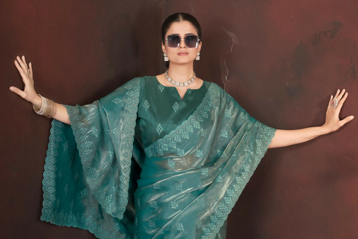 Vastranavya Teal Jimmy Choo Silk 3mm Sequence work with Cross Stitch Embroidery work & Cutwork Border Saree | Grocsy
