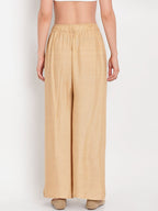 TAG 7 Women Beige Solid Straight Palazzos | Grocsy