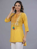 Juniper Women Yellow Muslin Printed High-Low Straight Tunic With Embroidered Yoke | Grocsy