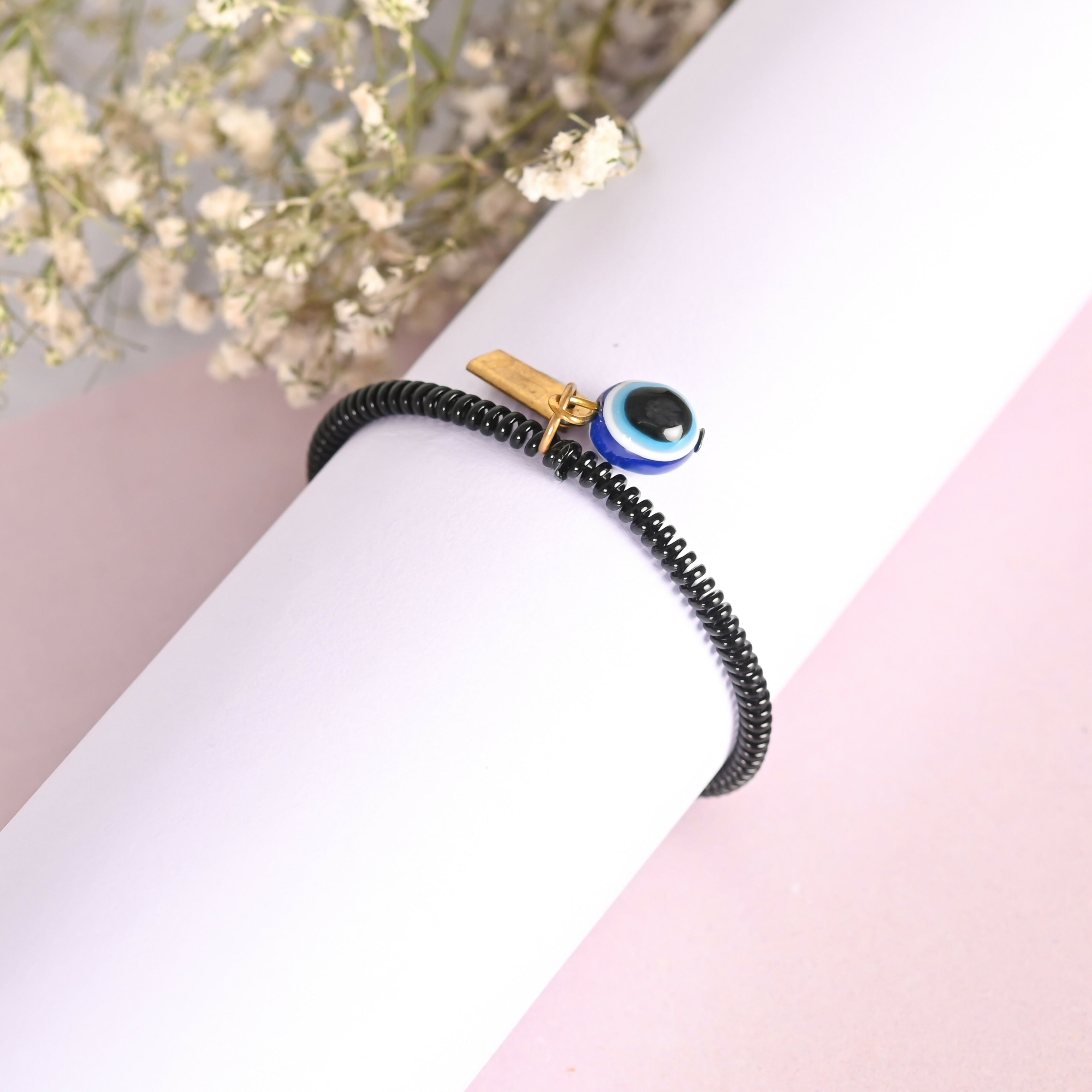 NVR Men & Women Black Evil Eye Crystal Spring Ring Bracelet | Grocsy