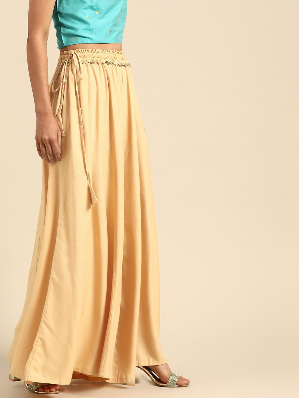 TAG 7 Women Beige Solid Flared Palazzos | Grocsy