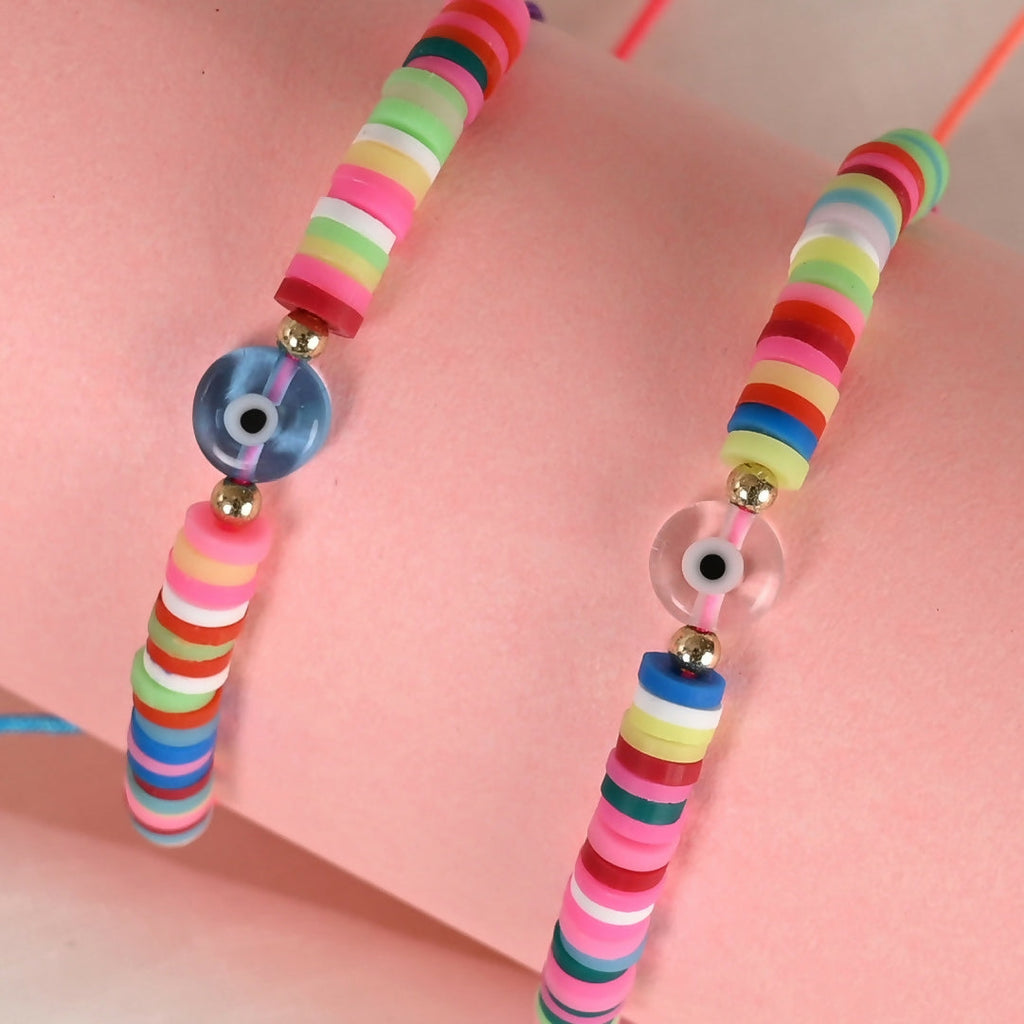 NVR Women & Men Set of 2 Multicolor Evil Eye Rakhi With Roli Chawal | Grocsy