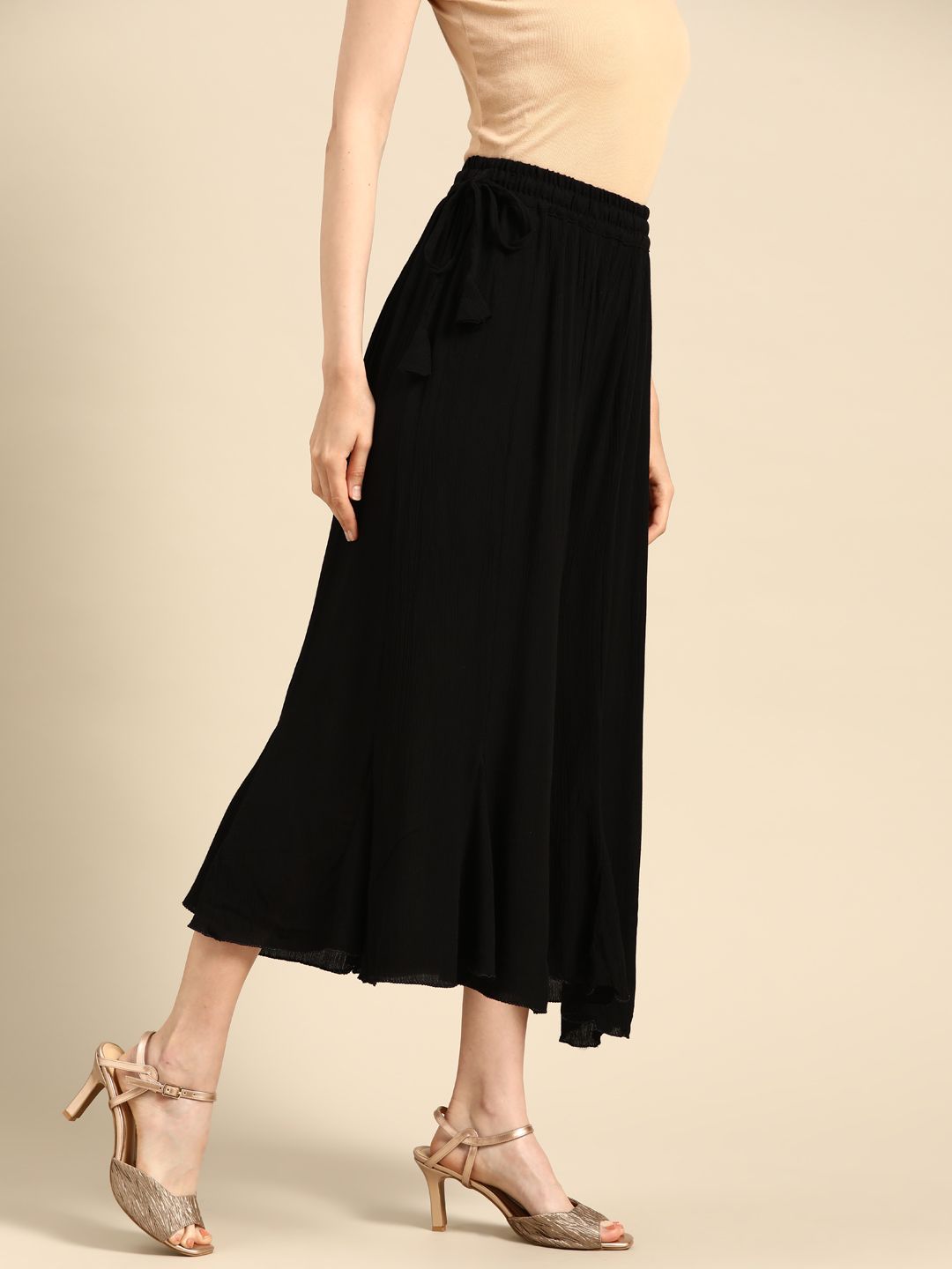 TAG 7 Women Black Solid Flared Cropped Palazzos | Grocsy