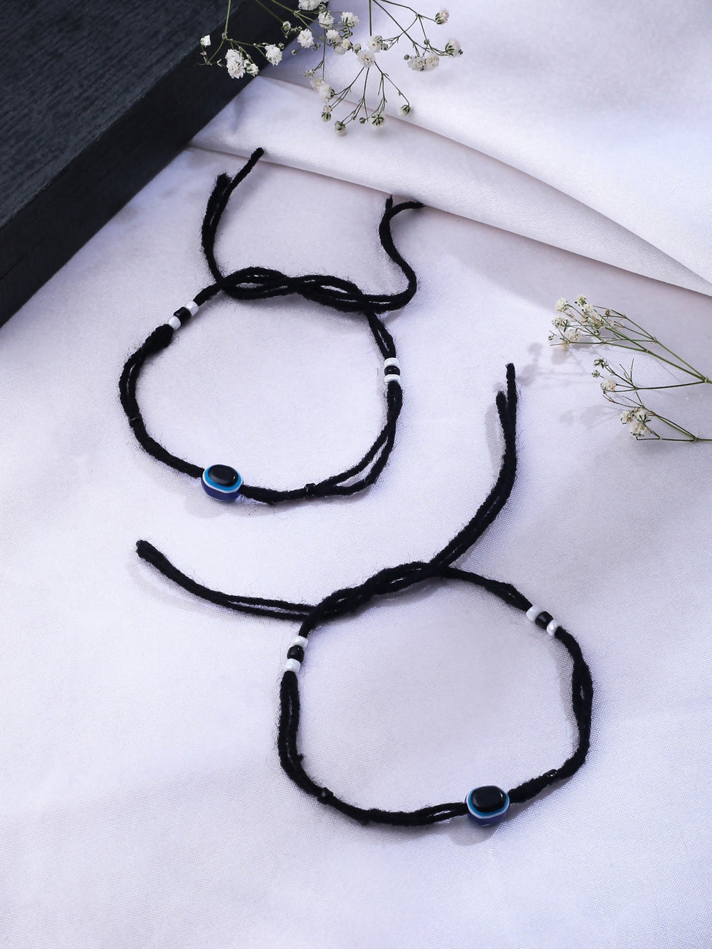 NVR Women & Men Set of 2 Black Evil Eye Rakhi With Roli Chawal | Grocsy