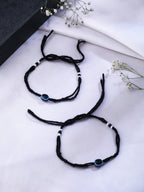 NVR Women & Men Set of 2 Black Evil Eye Rakhi With Roli Chawal | Grocsy