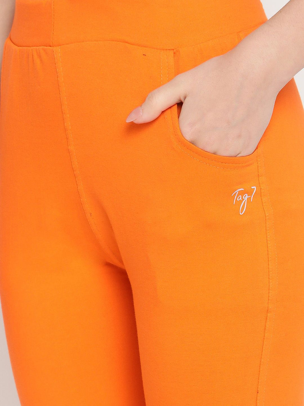 TAG 7 Women Orange Solid Leggings | Grocsy