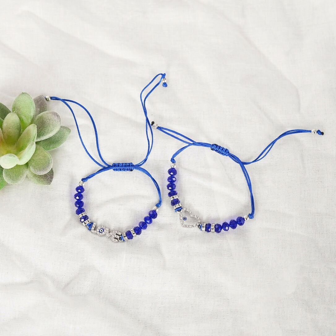 NVR Women & Men Set of 2 Blue Evil Eye Rakhi With Roli Chawal | Grocsy