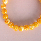 NVR Men & Women Yellow Marbel Crystal Elasticated Bracelet | Grocsy