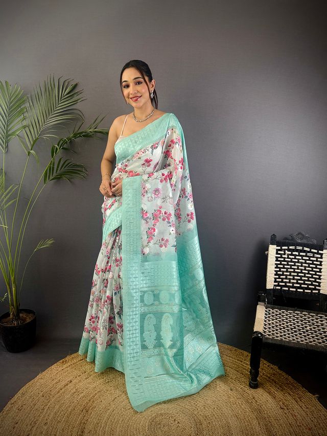 Elora Cyan Blue Silk Floral Motifs Coppery Tone Contrast Floral Border Banarasi Saree | Grocsy