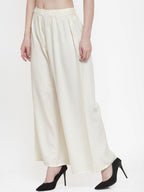 TAG 7 Women Off-White Solid Flared Palazzos | Grocsy