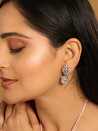 Nuyug Rhodium-Plated Rhinestone Studded Floral Minimal Cotemporary Studs | Grocsy
