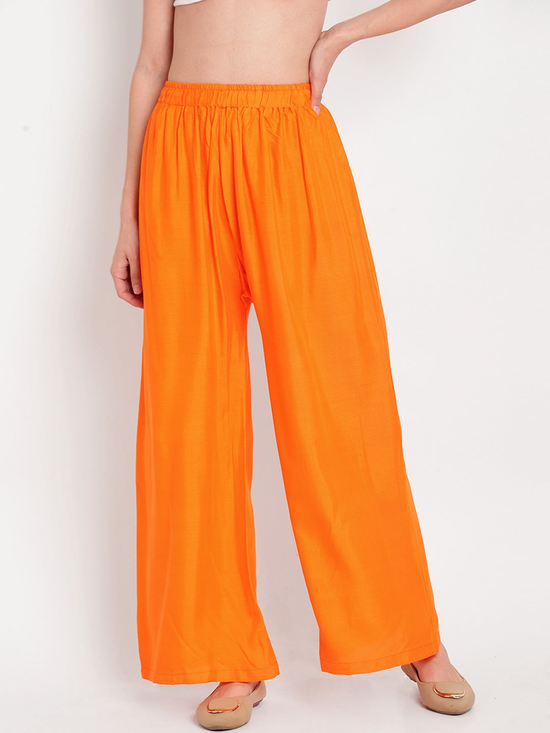 TAG 7 Women Orange Solid Flared Palazzos | Grocsy