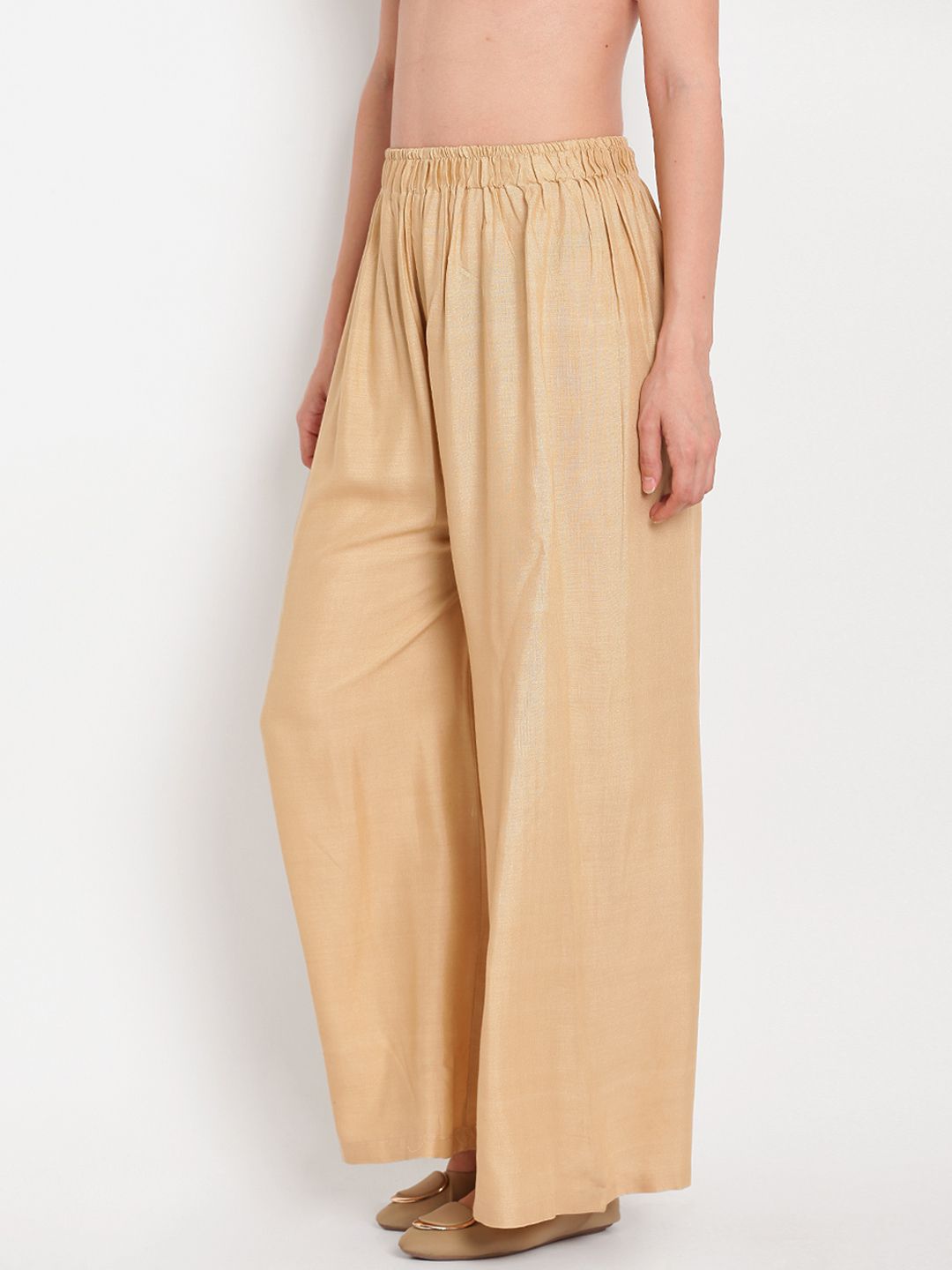 TAG 7 Women Beige Solid Flared Palazzos | Grocsy