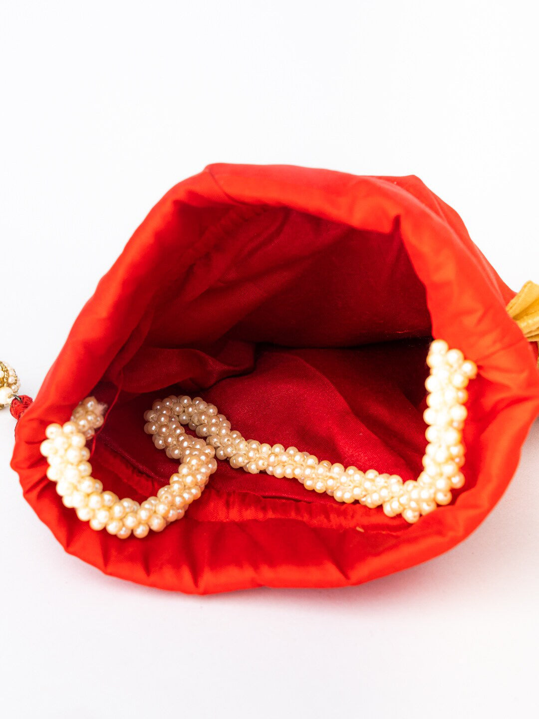 NR By Nidhi Rathi Red & White SHRINATHJI Embroidered Potli Clutch | Grocsy