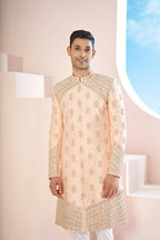The Peach Sherwani Features Hexagonal Butas , V-Shaped Floral Jal Borders by Hilo Design | Grocsy