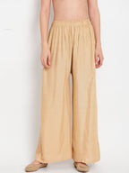 TAG 7 Women Beige Solid Flared Palazzos | Grocsy