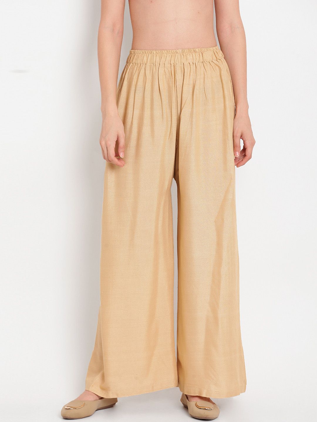 TAG 7 Women Beige Solid Flared Palazzos | Grocsy