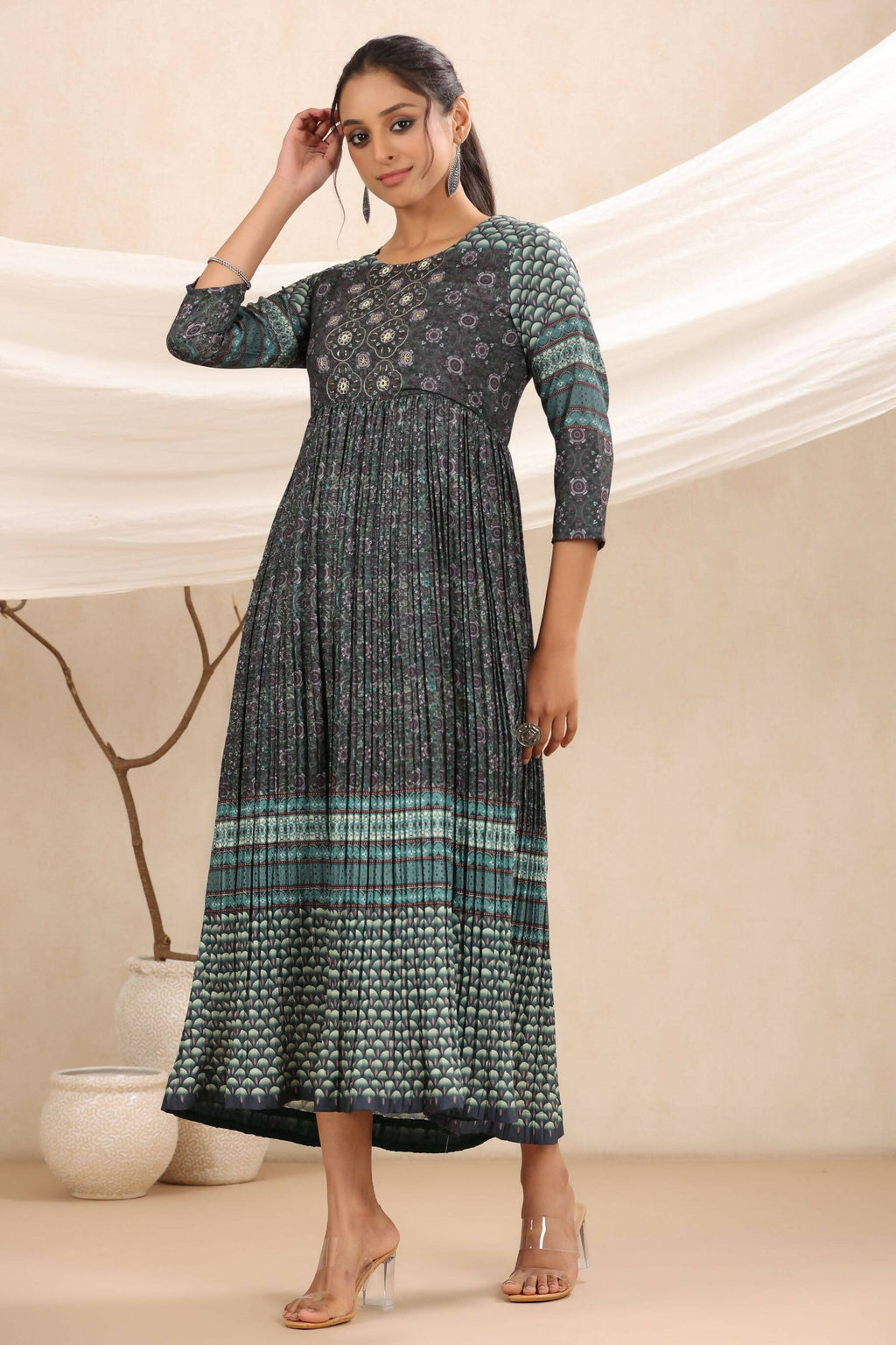 Juniper Bottle Green Muslin Festive Printed Flared Dress For Women | Grocsy