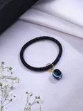 NVR Women & Men Black Evil Eye Spring Ring Rakhi With Roli Chawal | Grocsy