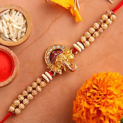 Beautiful Ganesha Rakhi and Silk Chocolates | Grocsy